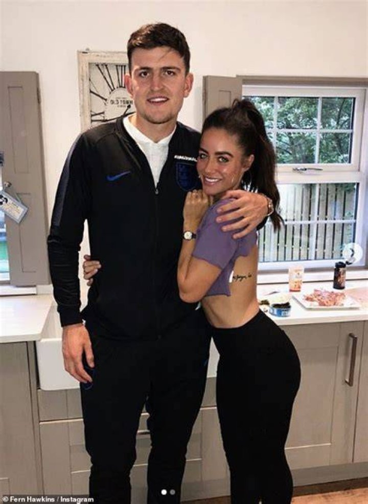 Harry Maguire playfully wrestles his mother Zoe into the sea on fun