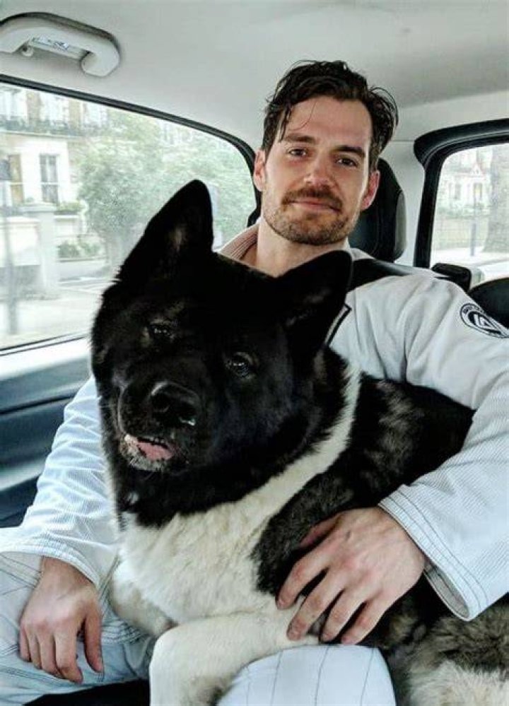 Henry Cavill and his dog. 9GAG